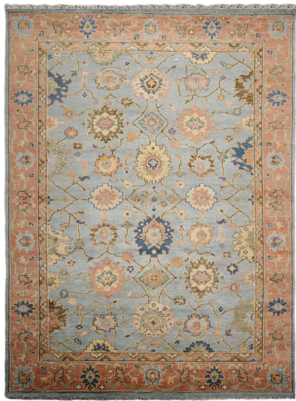 Traditional hand-knotted wool big rug featuring an ice blue center field and terracotta border in an elegant living room setting as seen in A16846.webp.
