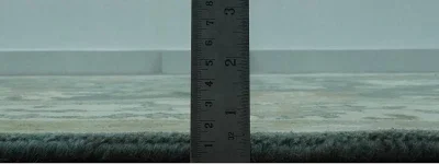 Edge profile showing the plush pile height of a custom-sized wool area rug.