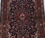 hand knotted antique rug in traditional vintage design