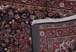 close up of hand knotted antique rug weave and patina